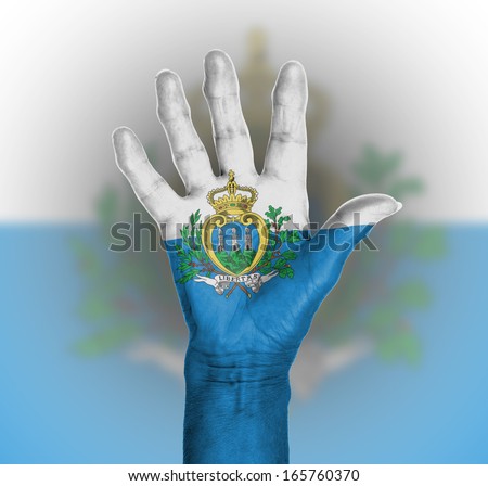 Palm of a woman hand, painted with flag of San Marino