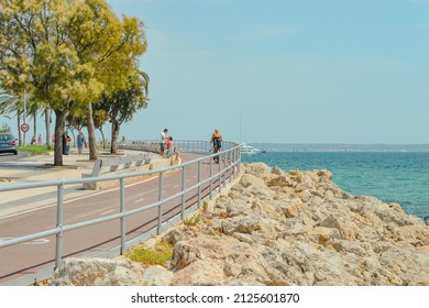 Palma de Mallorca, Balearic Islands, Spain: July 18th, 2015 - Passeig Maritim de Palma, pedestrian walk and bike lane on the Mediterranean seaside