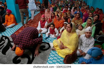 Palma de Mallorca, Spain. April 15, 2018. Indian Sikh sit inside a Sikh temple during their Baisakhi festival in Palma de Mallorca on the Spanish Balearic island of Mallorca. 