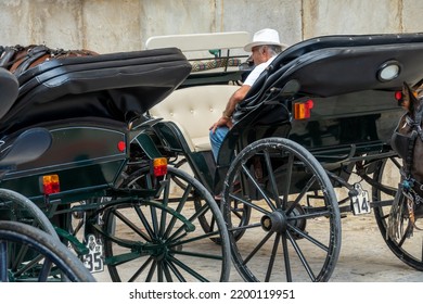 Palma De Mallorca, Spain; August-23, 2022: Man With White Hat Sitting In A Horse Carriage