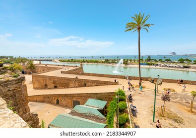 Palma de Mallorca, Spain - June 7 2022: View from the steps of the Palma Cathedral looking over the Mediterranean Sea, cruise port, and pond,  in Palma de Mallorca, Spain.