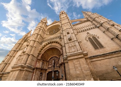 Palma de Mallorca, Spain - June 7 2022: The imposing facade of the Cathedral of Santa Maria of Palma, or La Seu, in the Mediterranean island city of Palma de Mallorca, Spain.