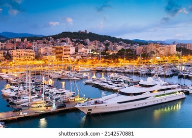 Palma de Mallorca, Spain skyline at the port with yachts in the early morning.