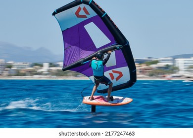 Palma de Mallorca,Spain - July 9, 2022: Miguel Barceló in a quick pass during the  Balearia Wing Foil Spain Series hosted by Club Náutico del Arenal
