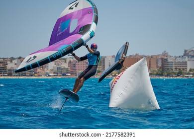 Palma de Mallorca,Spain - July 9, 2022: Rider tacking at the windward buoy during the competition of the Balearia Wing Foil Spain Series hosted by Club Náutico del Arenal