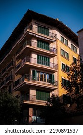 In Palma, Mallorca, Spain On 01 20 2022. Vertical View Of A Central Building In The City, With Special Attention To The Lady Who Appears On One Of The Terraces.