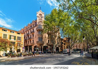 PALMA, SPAIN - APRIL 11, 2019: People walking on the street in the city center of Palma - aka Palma de Mallorca, capital and largest city of he Balearic Islands in Spain, popular tourist destination.
