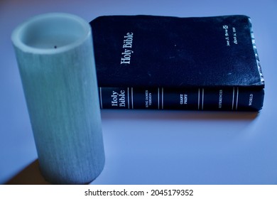 Palmdale, California  United States - September 20th 2021: Dark Toned Bible With Candle