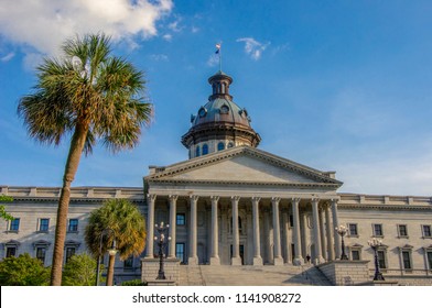 Palmetto Tree Stand Next To The Stair Leading To The Main Entrance To South Carolina’s Copper Dome Capital Building And Columbia, SC