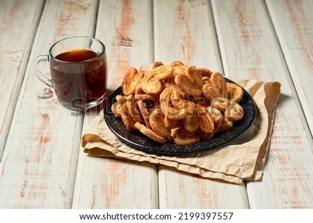 Palmier puff pastry cookie or homemade orejitas.