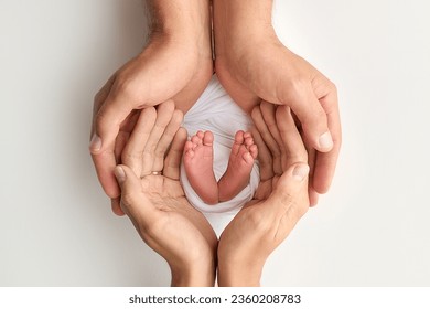 The palms of the father, the mother are holding the foot of the newborn baby on white background. Feet of the newborn on the palms of the parents. Photography of a child's toes, heels and feet - Powered by Shutterstock