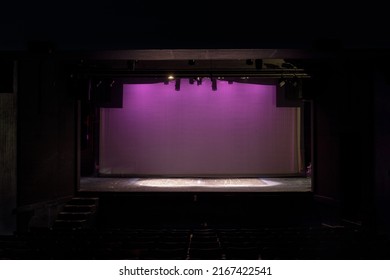 Palo Alto, California - September 13, 2021: Empty Old-fashioned Stage Lit in Pink on Cyclorama at the Palo Alto Childrens Theater