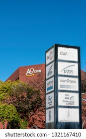 Palo Alto Transit Center Sign With Faded Names Transit Services - SamTrans, Caltrain, VTA, Dumbarton Express. A9.com Office Building In Background In Palo Alto, California, USA On February 22, 2019