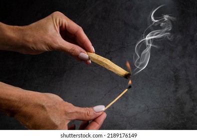 Palo Santo Burning In Front Of Dark Background