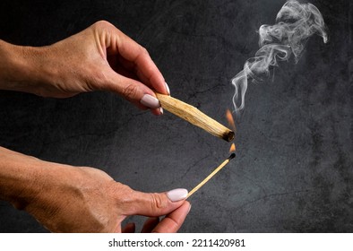 Palo Santo Burning In Front Of Dark Background