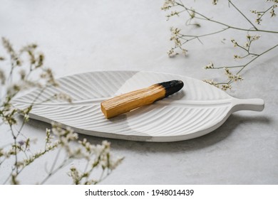 Palo Santo Stick In A Beautiful Plate. Healing, Meditation, Relaxation Concept. Palo Santo Wood