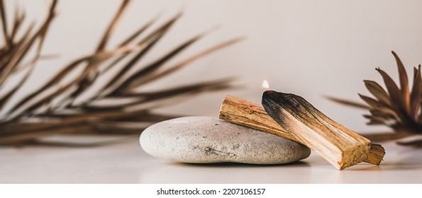 Palo Santo sticks on a light background.Aromatherapy religious rituals meditation.Wellness with aromatherapy and the occult.Healing incense Palo Santo.Organic incense of the holy ritual tree.Ibiokai
