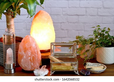 Palo Santo Wood  Which Also Known As “holy Wood” Or “wood Of The Saints”
In A Jewelry Box Near To The White Sage, Crystal Quartz And Salt Lamps.  Concept Of Eliminating Negative Energy From Home.  