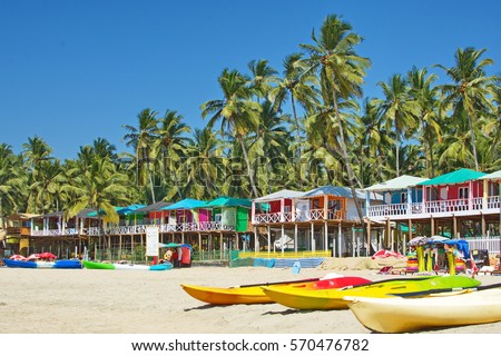 Palolem beach Southern Goa, India colorful sea front bungalows landscape