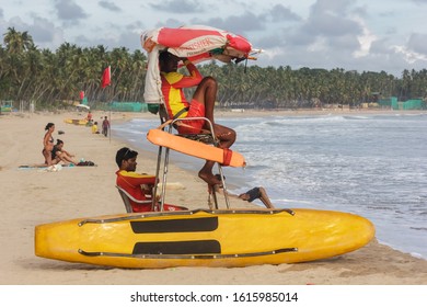 Palolem, Goa, India - June 2018: Two Lifeguards Keep Watch Over Tourists On The Popular Palolem Beach In Goa.