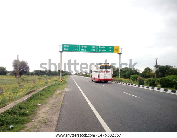 Palsana,Rajasthan/India-August\
11, 2019: A sign board on National Highway 52 which shows the\
distance of many\
cities.