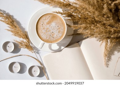 Pampas Grass And White Cup With Coffee. Empty Notebook Making A Plan For The Day. Drinking Cappuccino In The Breakfast Morning At Home. Flat Lay. Wallpaper. Aesthetics Cozy Home