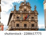 PAMPLONA , NAVARA - SPAIN .View of Consistorial Square and Town Hall building. Spanish and Navarra Flag. Beautiful architecture. 