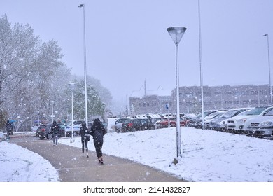 Pamplona, Navarra Spain April 01 2022, Surprise Snowfall In Early Spring, People On The Way To School Marists