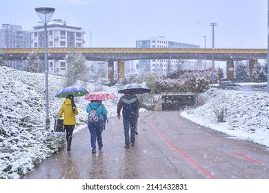 Pamplona, Navarra Spain April 01 2022, Surprise Snowfall In Early Spring, People On The Way To School Marists