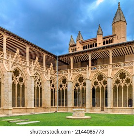Pamplona, Spain - June 21 2021: Ornate gothic cloister arcade arches of the Catholic Catedral de Santa Maria la Real, 15th Century Gothic Cathedral