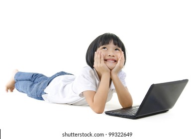 Pan Asian School Girl Using Laptop And Looking Up