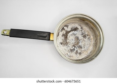 Pan With Burnt Food On White Background