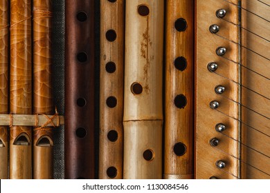 Pan Flute And Simple Wooden Flutes Next To The Psaltery, Close-up