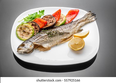 Pan Fried Grilled Roasted Cooked Whole Fish Trout Sea Bass Salmon Cod Salad Lemon White Plate