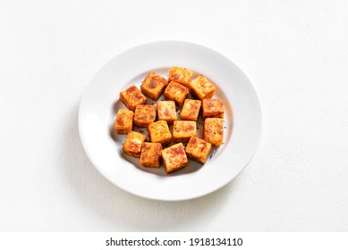 Pan Fried Paneer. Indian Roasted Cottage Cheese Bites On Plate Over White Background With Free Text Space. 