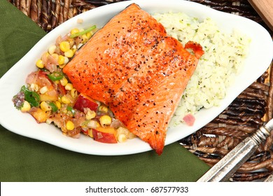 Pan Fried Salmon Fillet With Peach And Corn Salsa And Lime And Cilantro Jasmine Rice.