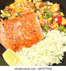 Pan Fried Salmon Fillet With Peach And Corn Salsa And Lime And Cilantro Jasmine Rice.