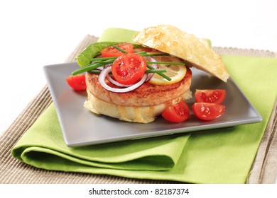 Pan Fried Salmon Patty In Cheese-topped Bun