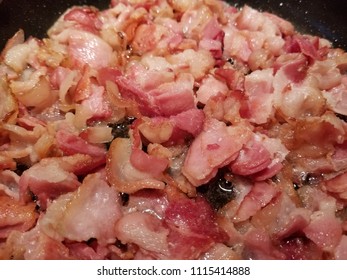 Pan Fried Sliced Hickory Smoked Bacon. A Bacon Background. 