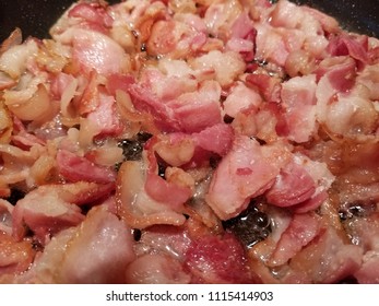 Pan Fried Sliced Hickory Smoked Bacon. A Bacon Background. 