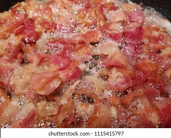 Pan Fried Sliced Hickory Smoked Bacon. A Bacon Background. 