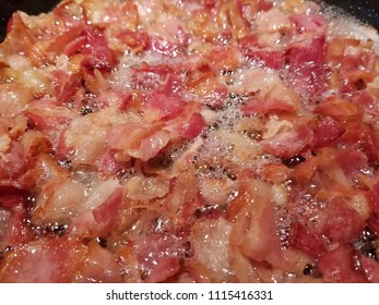 Pan Fried Sliced Hickory Smoked Bacon. A Bacon Background. 