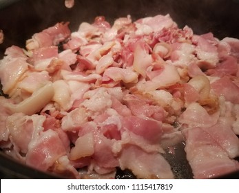 Pan Fried Sliced Hickory Smoked Bacon. A Bacon Background. 