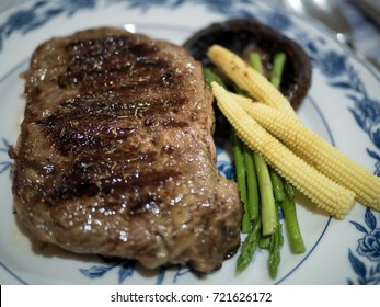 Pan Fried Steak Closeup,
Rib-eye Steak With Portobello Mushroom, Baby Corn And Asparagus Closeup With Selective Focus On Background