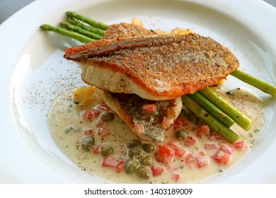 Pan Seared Sea Bass With Tomato Caper Mustard Cream Sauce