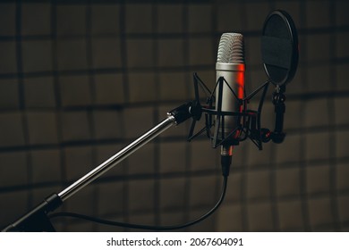 Pan Shot Of A Professional Microphone For Dubbing And Voice Over In The Sound Recording Studio. Close Up, Podcasting Concept