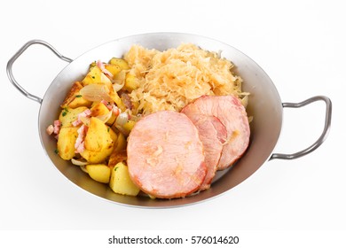 A Pan With Smoked Pork Chop An Potatoes