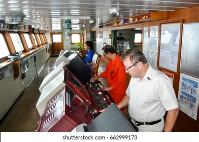 Panama April 10, 2010: Captain Of Container Vessel Hanjin Colombo And Pilot On The Captain`s Bridge Of The Merchant Ship