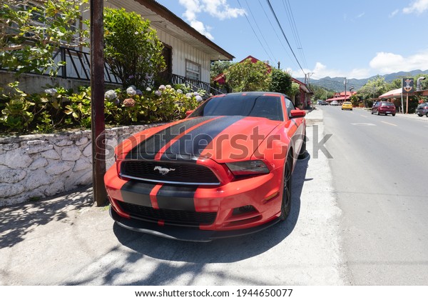 Panama Boquete March 26,\
red Ford Mustang GT coupe parked in the town center. Shoot on March\
26, 2021