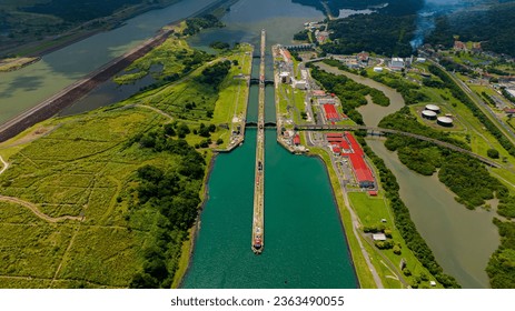 Panama Canal area view, container ship transit, water tanks, composed of locks